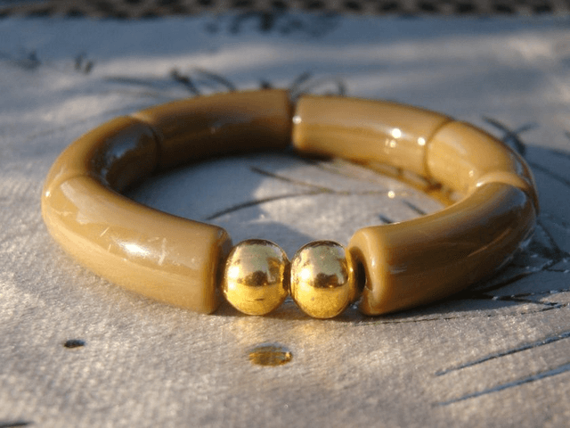 Bracelet perles tubes incurvées unies Khazaana Savaana